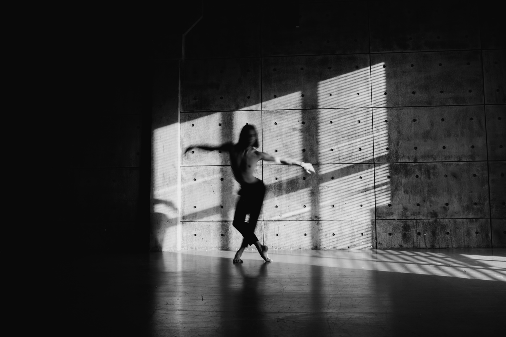 A Shirtless Man Dancing in the Dance Studio